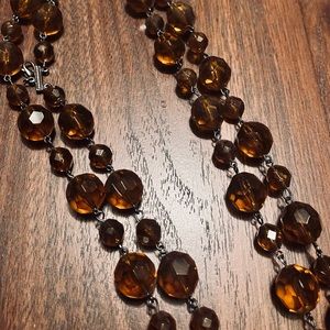 Amber In color…beautiful stone necklace from anthropology